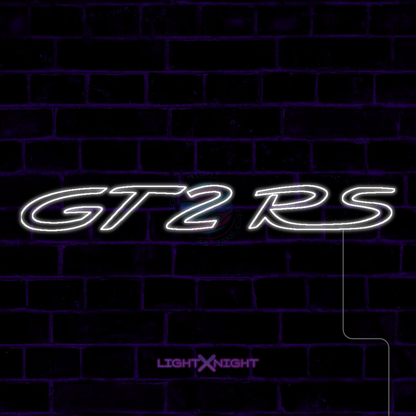 White Porsche GT2 RS lettering LED neon sign displayed on a dark brick wall
