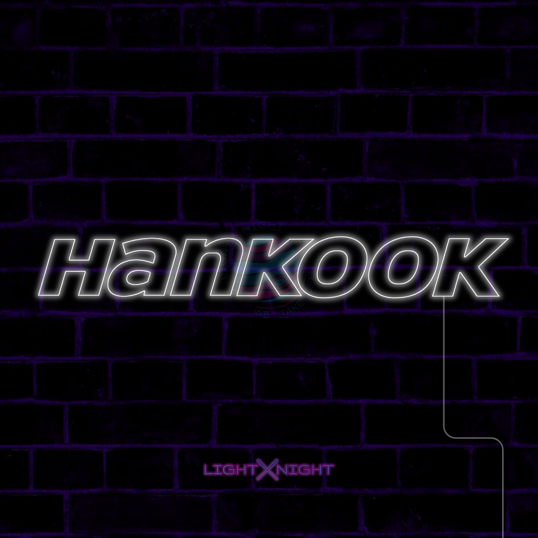 White Hankook lettering LED neon sign displayed on a dark brick wall
