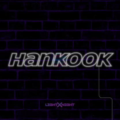 White Hankook lettering LED neon sign displayed on a dark brick wall
