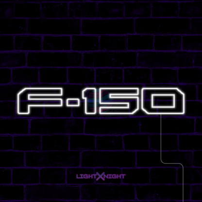 White Ford F-150 lettering LED neon sign displayed on a dark brick wall