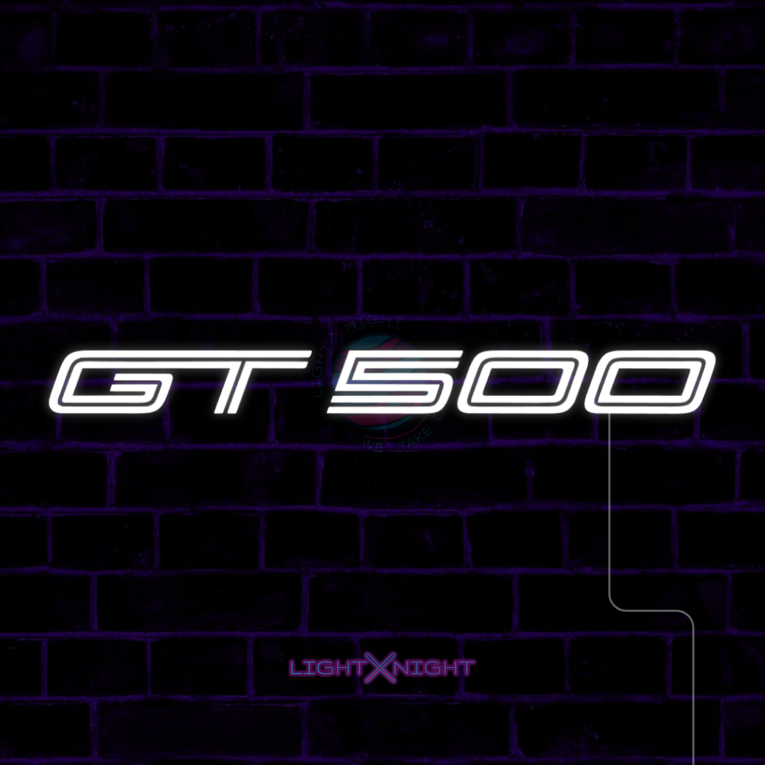 White Ford Mustang Shelby GT500 lettering LED neon sign displayed on a dark brick wall