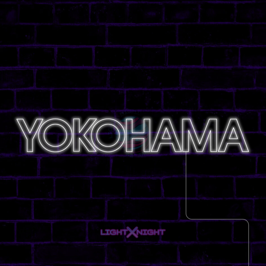 White Yokohama lettering LED neon sign displayed on a dark brick wall
