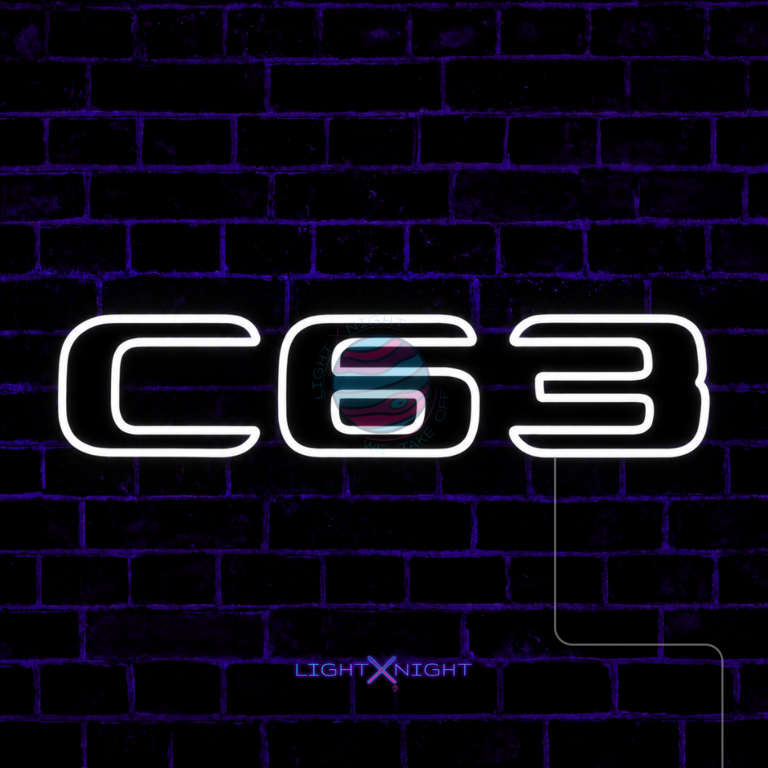 White Mercedes-AMG C63 lettering LED neon sign displayed on a dark brick wall