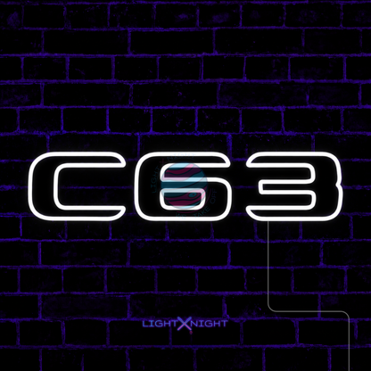 White Mercedes-AMG C63 lettering LED neon sign displayed on a dark brick wall