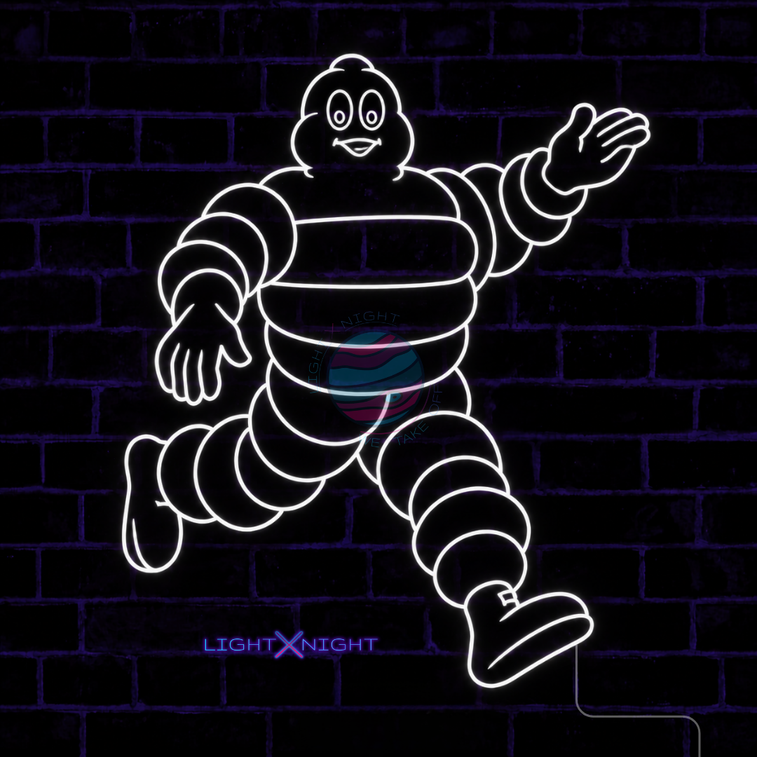White Michelin Man character LED neon sign displayed on a dark brick wall